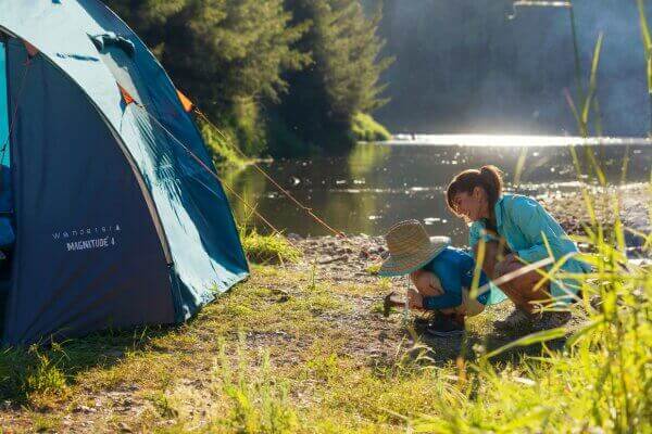 Family setting up camp during Easter holidays