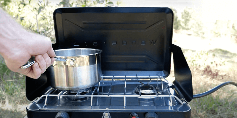Cooking under a gazebo during wet weather camping