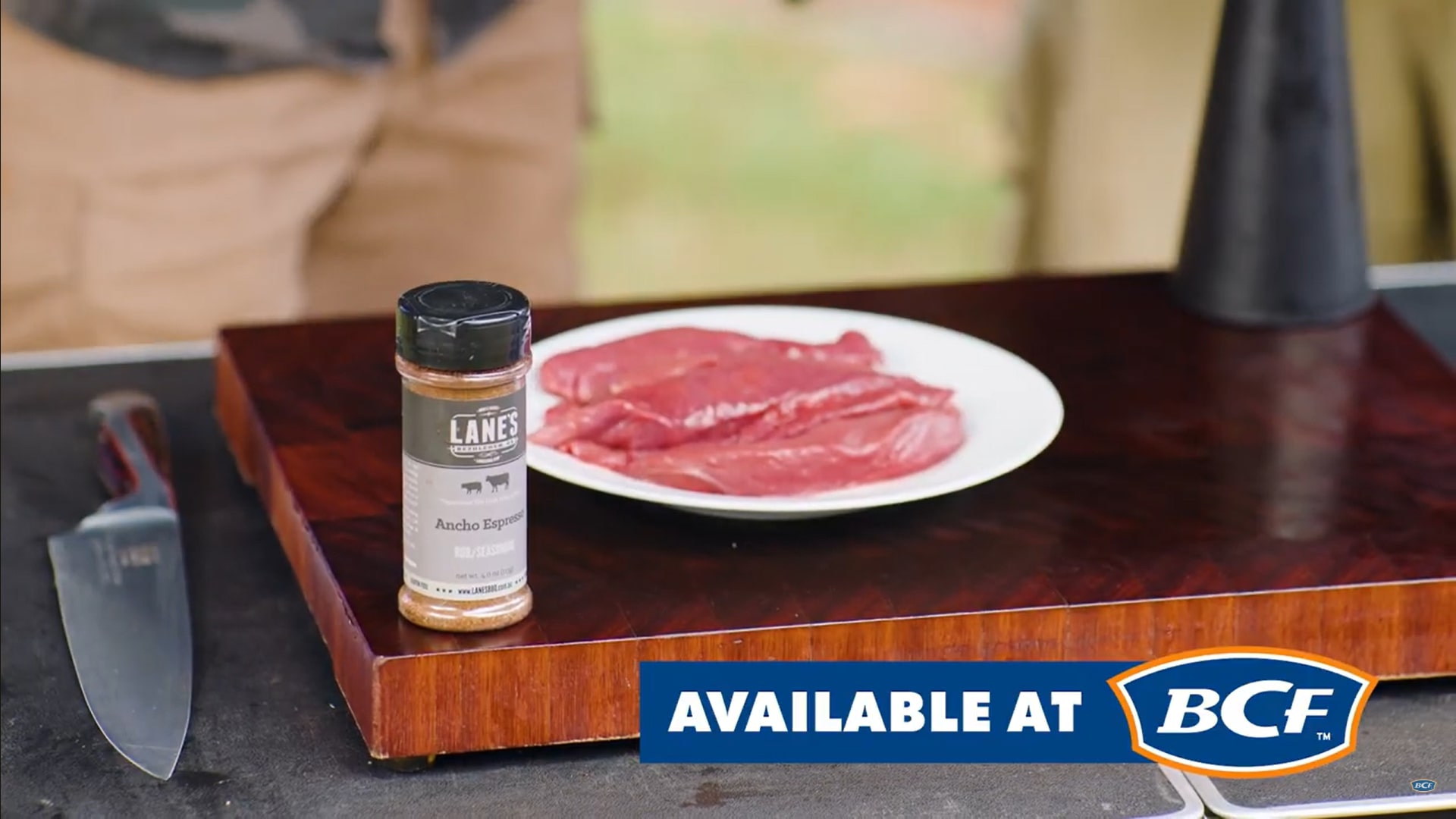 Seasoning kangaroo steaks with Lanes BBQ rub