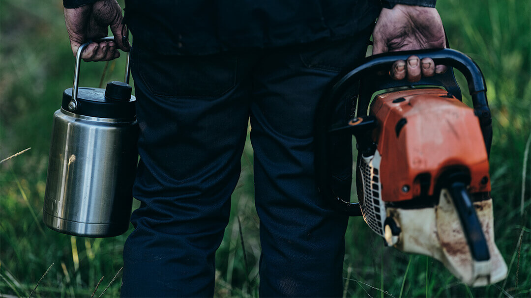 Father and daughter sitting under the shade on the beach