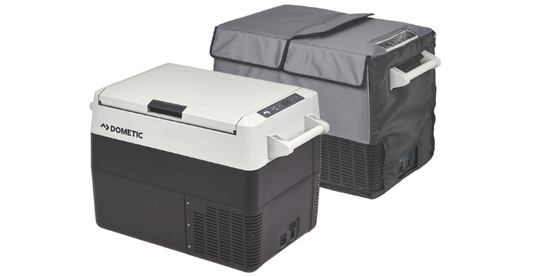 Dometic CFF45 fridge freezer sitting beside a vehicle at camp