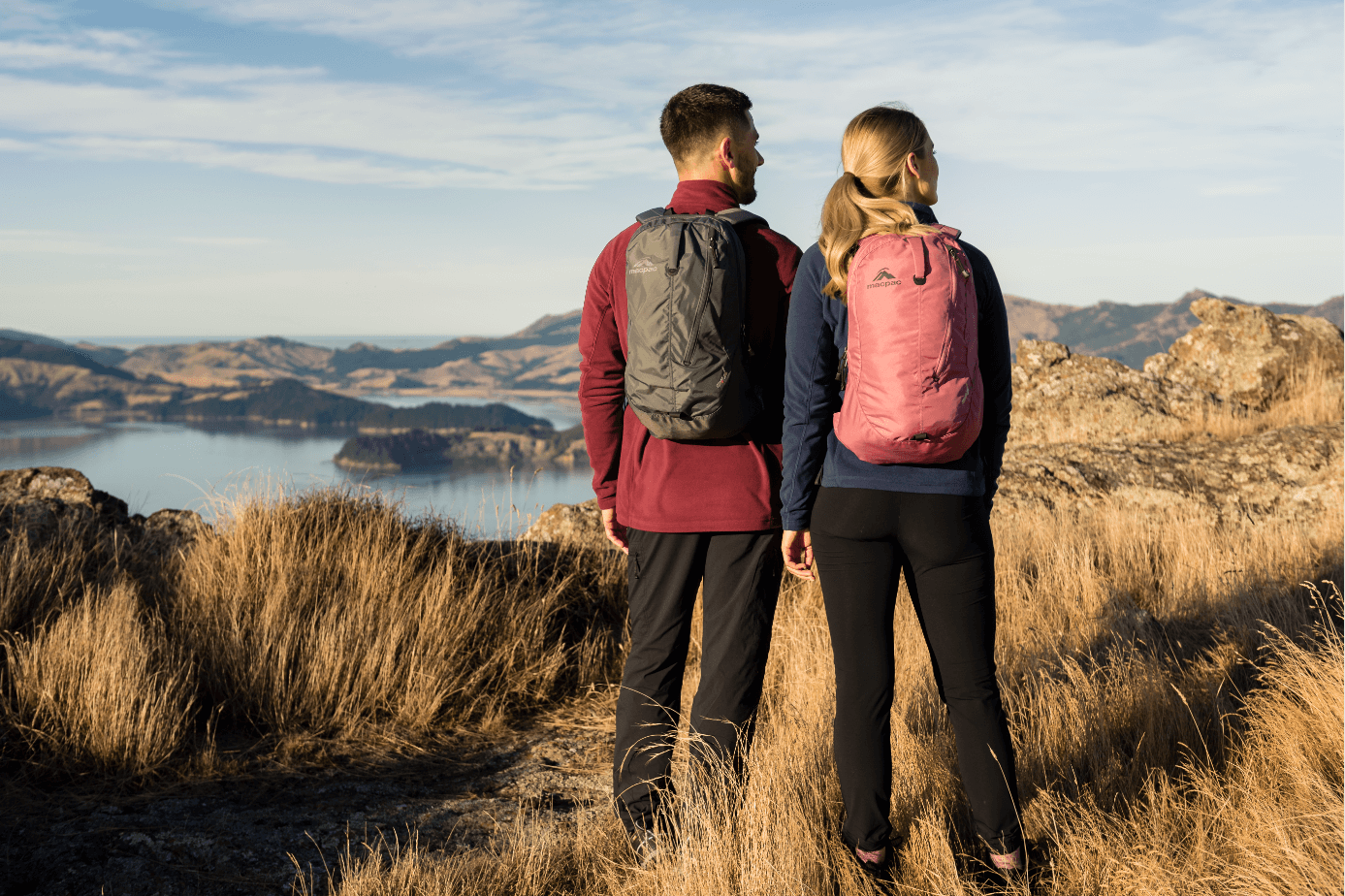 Couple walking with backpack