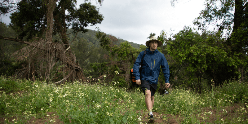 Family enjoying camping in the rain under shelter